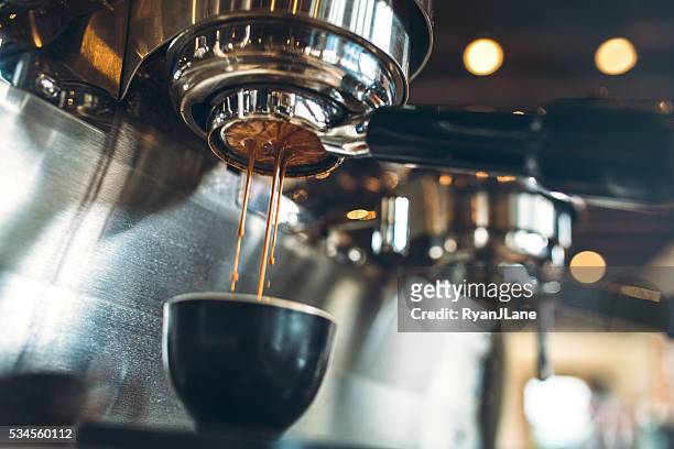 espresso machine pulling a shot - coffee machine stock pictures, royalty-free photos & images