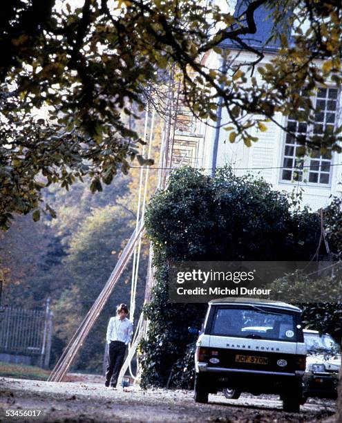 Musician Mick Jagger of The Rolling Stones takes a walk outside his castle La Fouchette in 1985 in Paris, France.