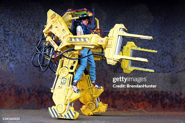 heavy lifting - powered exoskeleton stock pictures, royalty-free photos & images