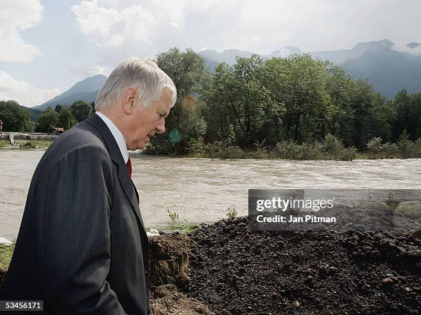 Germany's Minister for the Interior Otto Schily walks along the Loisach river on August 24, 2005 in Eschenlohe, Germany. Flooding has caused...