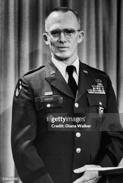 American soldier Brigadier General James Dozier stands behind a podium at a Pentagon press conference where he spoke shortly after returning from...