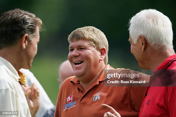 John Daly of the USA enjoys a joke while he waits to tee off on the par three 8th hole during the pro am prior to the BMW International Open Golf at...