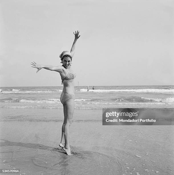 Italian actress Lucia Banti joking on the beach during the XVIII Venice International Film Festival. Venice, 1957