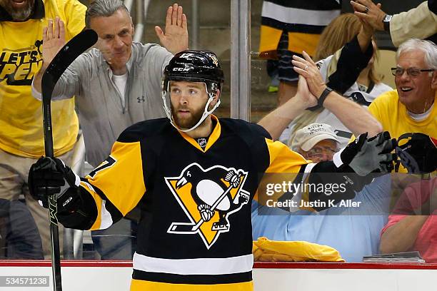 Bryan Rust of the Pittsburgh Penguins celebrates after scoring a goal against Andrei Vasilevskiy of the Tampa Bay Lightning during the second period...