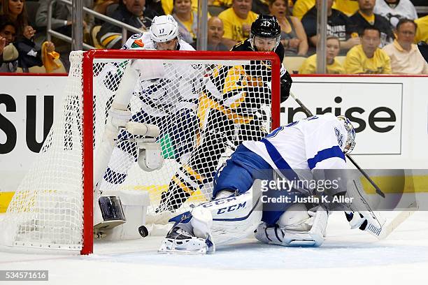 Bryan Rust of the Pittsburgh Penguins scores a goal against Andrei Vasilevskiy of the Tampa Bay Lightning during the second period in Game Seven of...
