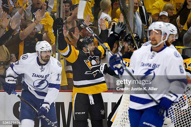Bryan Rust of the Pittsburgh Penguins celebrates with his teammates after scoring a goal against Andrei Vasilevskiy of the Tampa Bay Lightning during...