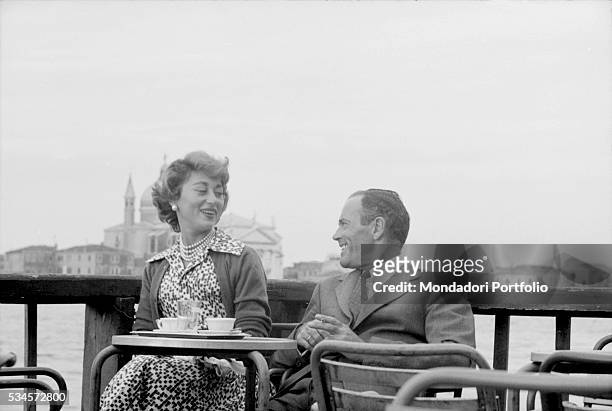 American actor Henry Fonda and his wife, Italian baroness Afdera Franchetti, relaxing at a cafè during the XVIII Venice International Film Festival....