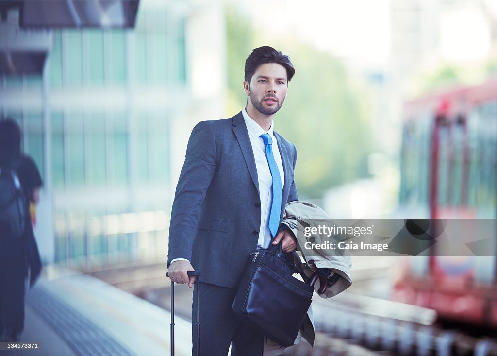 Businessman waiting at train station