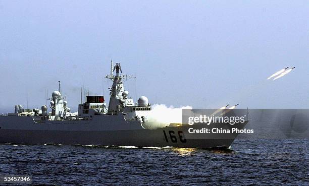 Chinese destroyer launches missiles in an offshore blockade exercise during the third phase of the Sino-Russian "Peace Mission 2005" joint military...