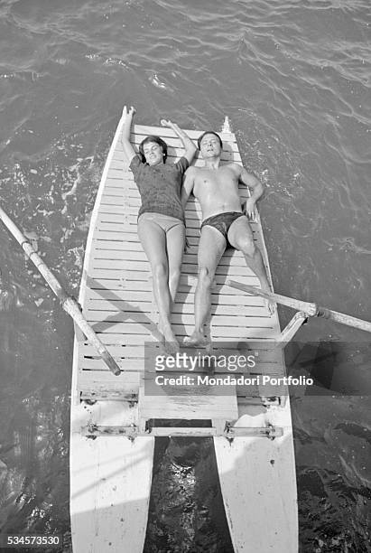 Italian actor Franco Interlenghi and his wife, Italian actress Antonella Lualdi , relaxing on a boat during the XVIII Venice International Film...