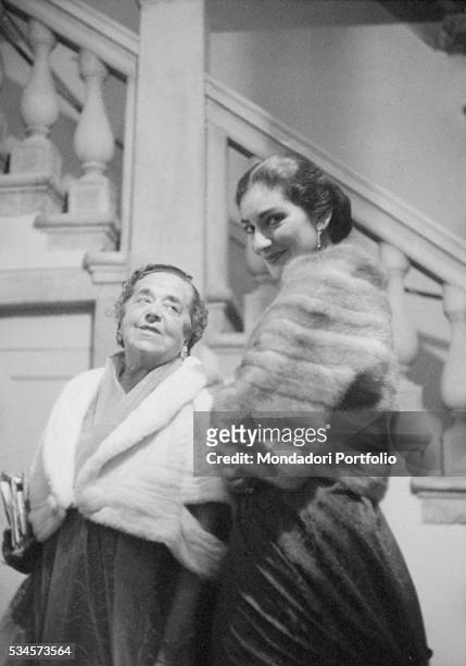 Greek soprano Maria Callas and American journalist Elsa Maxwell attending to a party during the XVIII Venice International Film Festival. Venice, 1957