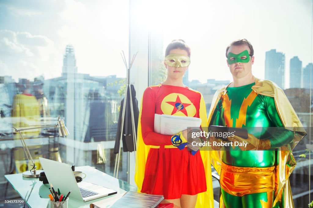 Superheroes standing in office