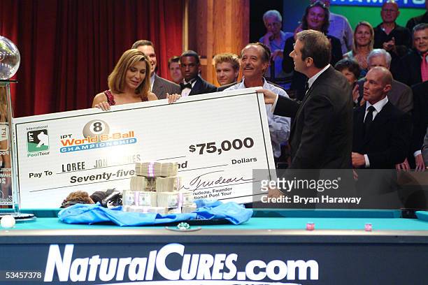 Runner up Loree Jon Jones accepts a check from sponsor Kevin Trudeau at the International Pool Tour World 8-Ball Championship at the Mandalay Bay...