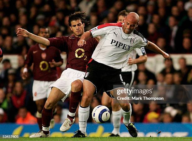 Francese Fabregas of Arsenal battles with Claus Jensen of Fulham during the Barclays Premiership match between Arsenal and Fulham at Highbury on...