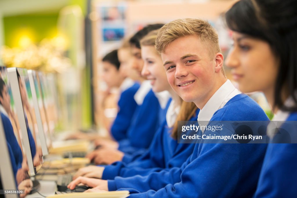 Happy students learning in computer room