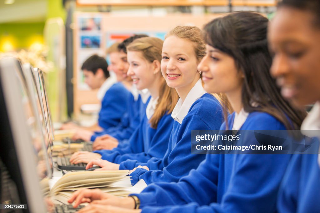 Sit In Rows Students Sitting In Row During It Lesson High-Res Stock Photo - Getty ...