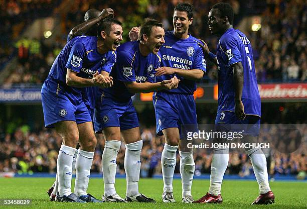 London, UNITED KINGDOM: Chelsea's Frank Lampard celebrates with teammates after scoring his second goal against West Brom during the Premiership game...