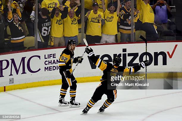 Matt Cullen and Carl Hagelin of the Pittsburgh Penguins celebrate in the third period against the Tampa Bay Lightning in Game Seven of the Eastern...