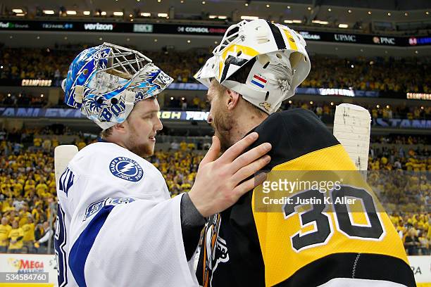 Andrei Vasilevskiy of the Tampa Bay Lightning congratulates Matt Murray of the Pittsburgh Penguins celebrate after defeating the Tampa Bay Lightning...