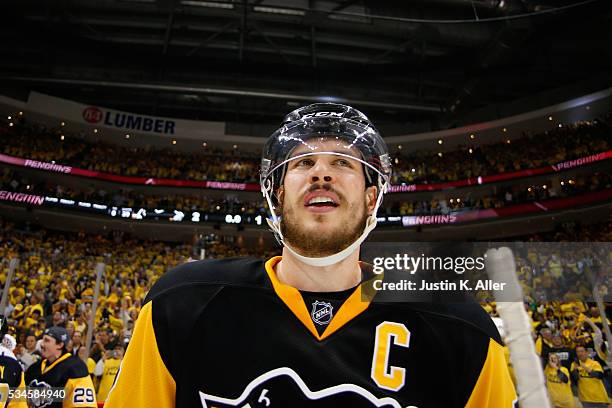 Sidney Crosby of the Pittsburgh Penguins celebrates after defeating the Tampa Bay Lightning in Game Seven of the Eastern Conference Final with a...