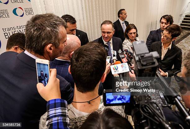 Prime Minister of New Zealand John Key talks to the media on May 27, 2016 in Auckland, New Zealand. Finance Minister Bill English released his eighth...