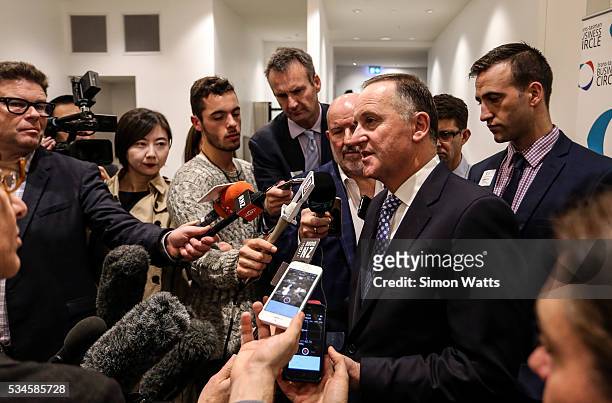 Prime Minister of New Zealand John Key talks to the media on May 27, 2016 in Auckland, New Zealand. Finance Minister Bill English released his eighth...