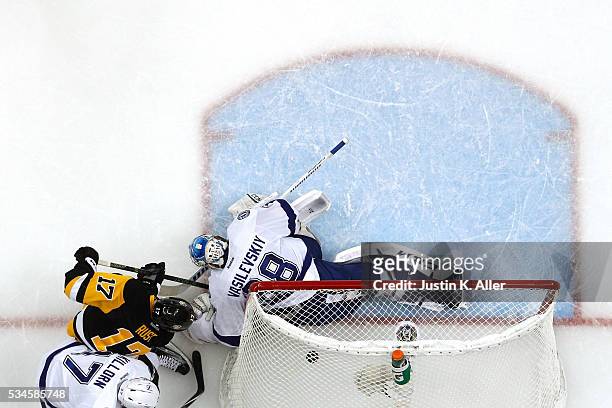 Bryan Rust of the Pittsburgh Penguins scores his second goal against Andrei Vasilevskiy of the Tampa Bay Lightning during the second period in Game...