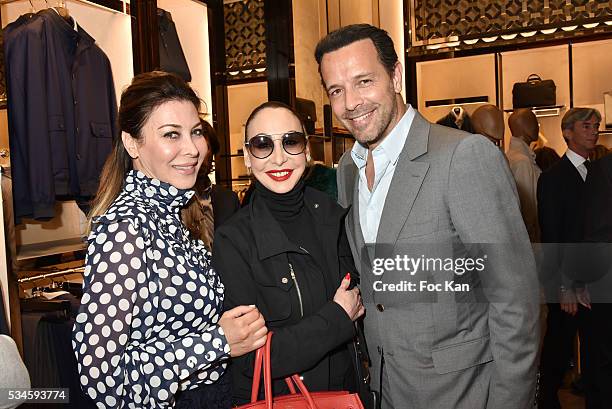 Eva Benhamou from FirstLuxe magazine, Stefanie Renoma and Olivier Careras attend Corneliani Paris Shop Opening Party on May 26, 2016 in Paris, France.