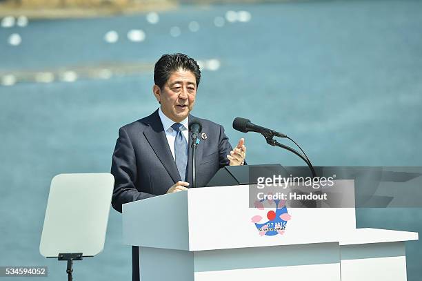 In this handout image provided by Foreign Ministry of Japan, Japanese Prime Minister Shinzo Abe speaks during the presidency press conference at the...