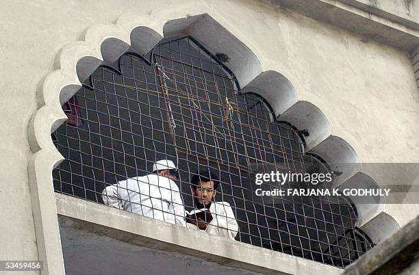 Two Bangladeshi madrassa students read books at their madrassa in Dhaka, 25 August 2005. Authorities have made "substantial progress" in their...