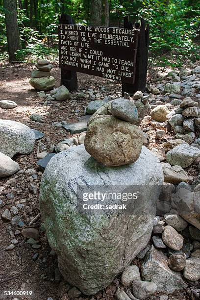 walden cabin site, cairn of stones, thoreau quote - walden stock pictures, royalty-free photos & images