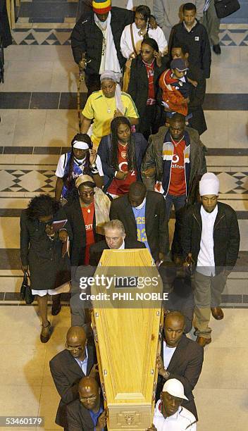 Liverpool, UNITED KINGDOM: Family members follow the coffin of murdered teenager Anthony Walker as it is carried from Liverpool Cathedral following...