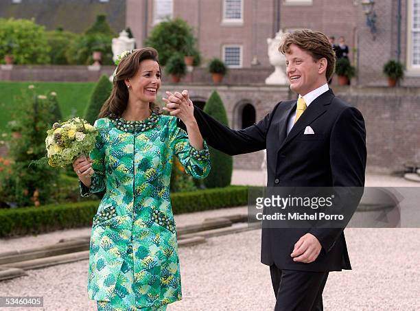 Dutch Prince Pieter Christiaan and Anita van Eijk laugh after they kissed after the civil wedding ceremony at The Loo Palace on August 25 2005 in...
