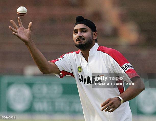 Indian cricketer Harbhajan Singh catches the ball during a training session 25 August 2005 on the eve of the match against New Zealand in Bulawayo,...