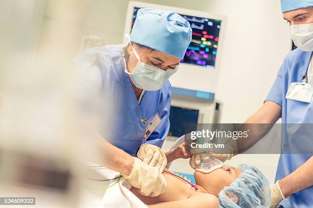 child in operating room - pediatric intensive care unit stock pictures, royalty-free photos & images