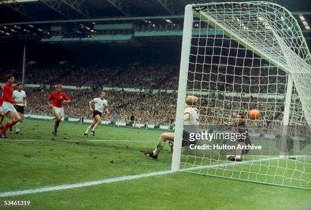 Martin Peters scores England's 2nd goal against West Germany in the World Cup final at Wembley, 30th July 1966.