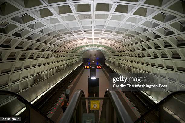 Commuters wait for a train in a mostly empty South Capitol metro station during the Government Shutdown.