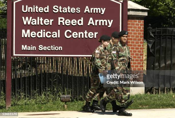 Members of the U.S. Military walk out of the gate at Walter Reed Army Medical Center August 25, 2005 in Washington, DC. Earlier today the Base...