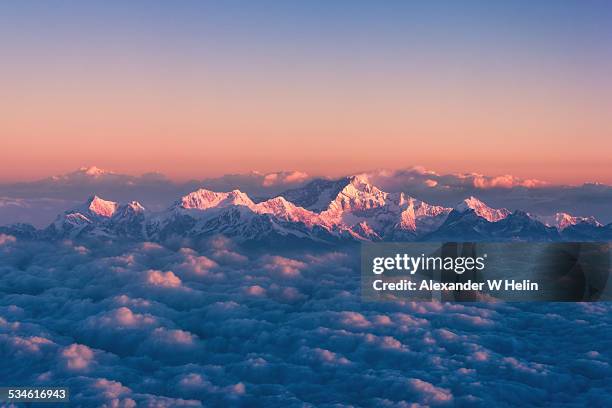 above the clouds - himalayas stock pictures, royalty-free photos & images