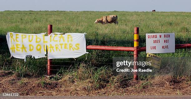 Two opposing views are represented by signs posted near a cattle pasture near August 25, 2005 near president George W. Bush's ranch in Crawford,...