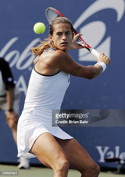 Amelie Mauresmo of France lines up a backhand against Anna-Lena Groenefeld of Germany during the Pilot Pen Tennis tournament on August 25, 2005 at...