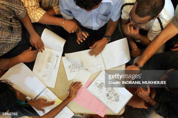 Animators at Crest Communications work on storyboard in Mumbai, 24 August 2005. Animation business in India, which touched some 300 million USD in...