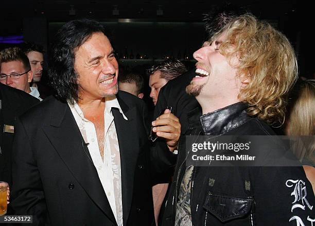 Nickelback frontman Chad Kroeger shares a laugh with Kiss singer/bassist Gene Simmons during Simmons' birthday party at the Ghostbar at the Palms...