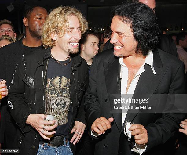 Nickelback frontman Chad Kroeger shares a laugh with Kiss singer/bassist Gene Simmons during Simmons' birthday party at the Ghostbar at the Palms...