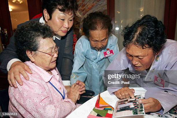 South Korean Kim Ki-Ok 88 years old cries as she meets her North Korean family at the Kumgangsan hotel on August 26, 2005 in Mt. Kumgang, North...