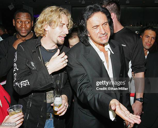 Nickelback frontman Chad Kroeger talks with Kiss singer/bassist Gene Simmons during Simmons' birthday party at the Ghostbar at the Palms Casino...
