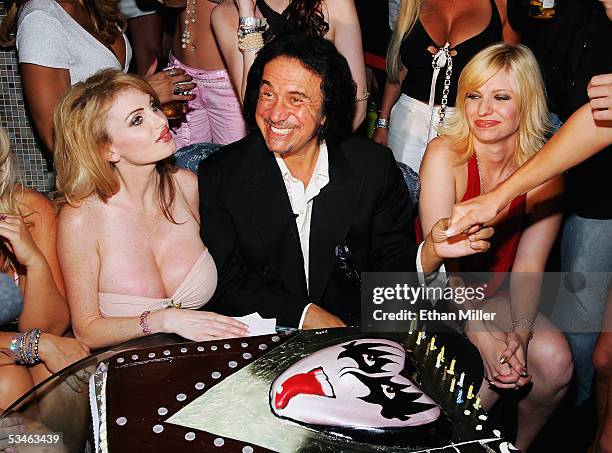 Kiss singer/bassist Gene Simmons is surrounded by friends, including adult film actress Taylor Wane , during his birthday party at the Palms Casino...