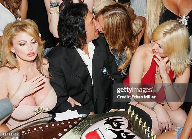 Kiss singer/bassist Gene Simmons kisses a guest during his birthday party at the Palms Casino Resort August 25, 2005 in Las Vegas, Nevada. Adult film...