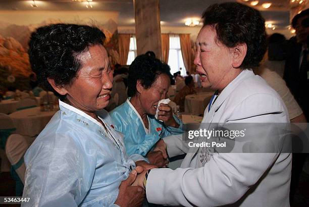 South Korean Kim Soon-Dan , 72 years old cries as she meets her North Korean sisters at the Kumgangsan hotel on August 26, 2005 in Mt. Kumgang, North...