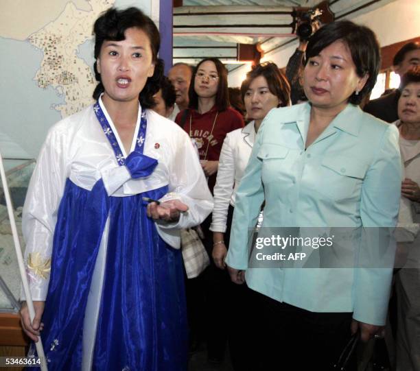 North Korean guide explains about historical sites as Hyundai Group Chairwoman Hyun Jeong-eun listens at the Koryo Dynasty's Museum in Kaesong, North...